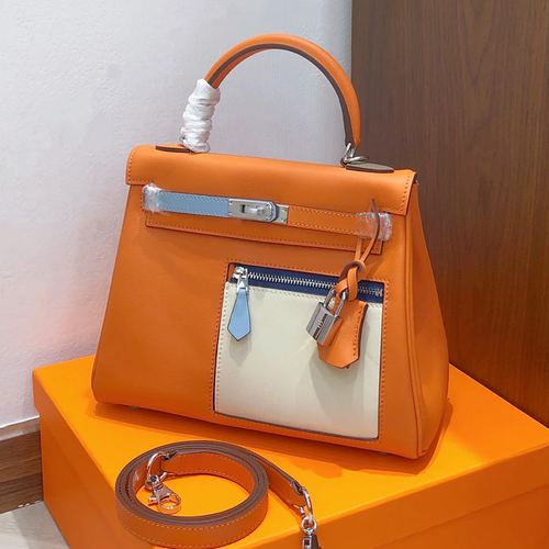 Vibrant Sun Orange Multi-Tone Color Block Compact Trapezoid Hand Tote With Sleek Silvery Twist Lock Hardware And Exterior Zippered Patch Pocket
