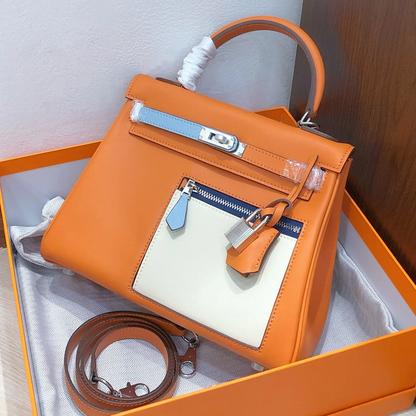 Vibrant Sun Orange Multi-Tone Color Block Compact Trapezoid Hand Tote With Sleek Silvery Twist Lock Hardware And Exterior Zippered Patch Pocket