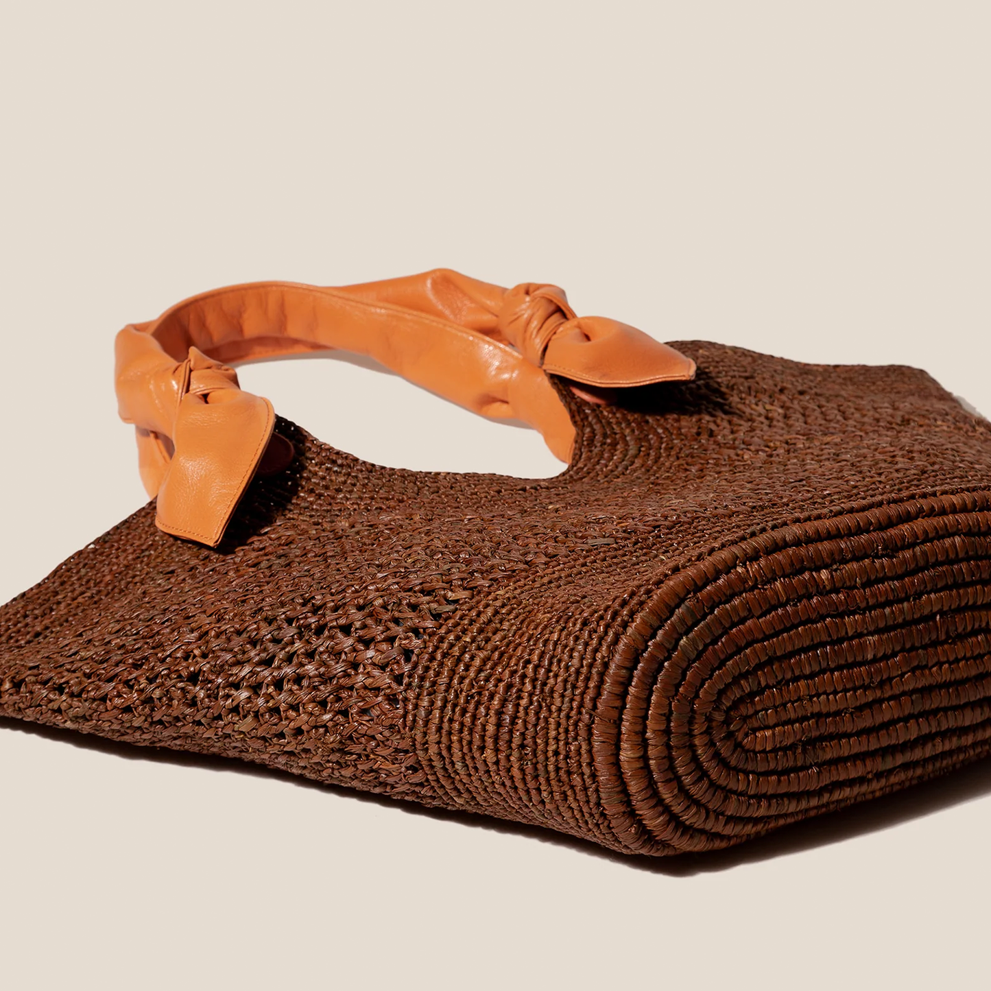 Deep Umber Brown Hand Crocheted Fan Shaped Woven Tote With Vibrant Tangerine Knotted Accent Shoulder Grip Straps